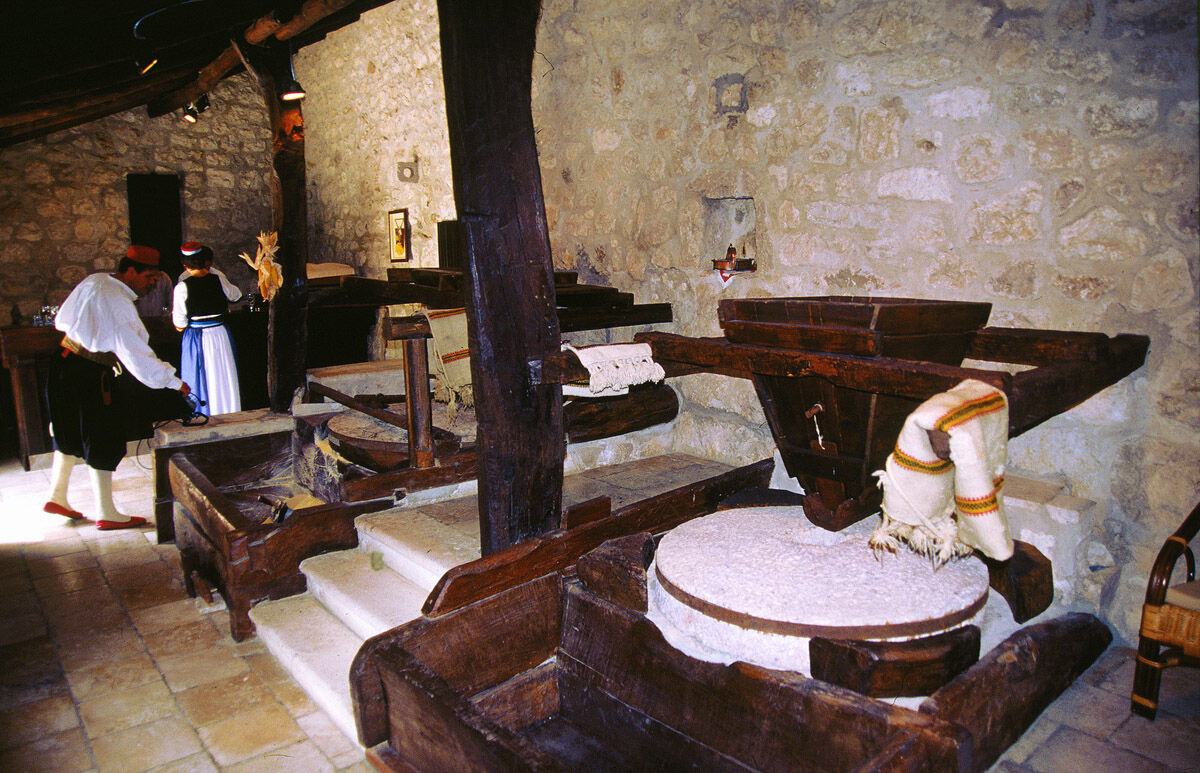 Traditional wooden milling equipment inside the old mill in Konavle