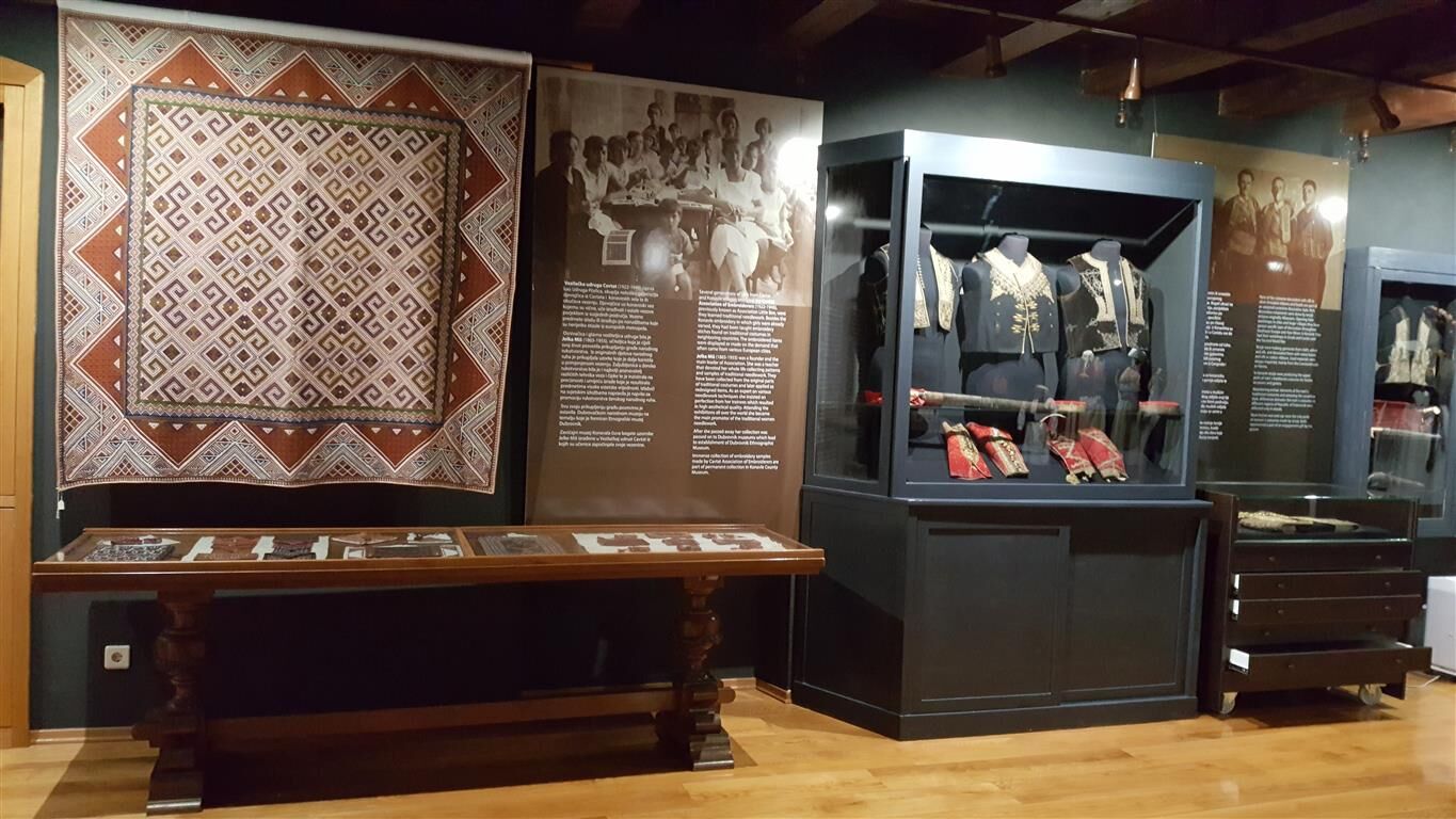 Traditional textiles and clothing displayed inside the County Museum in Čilipi
