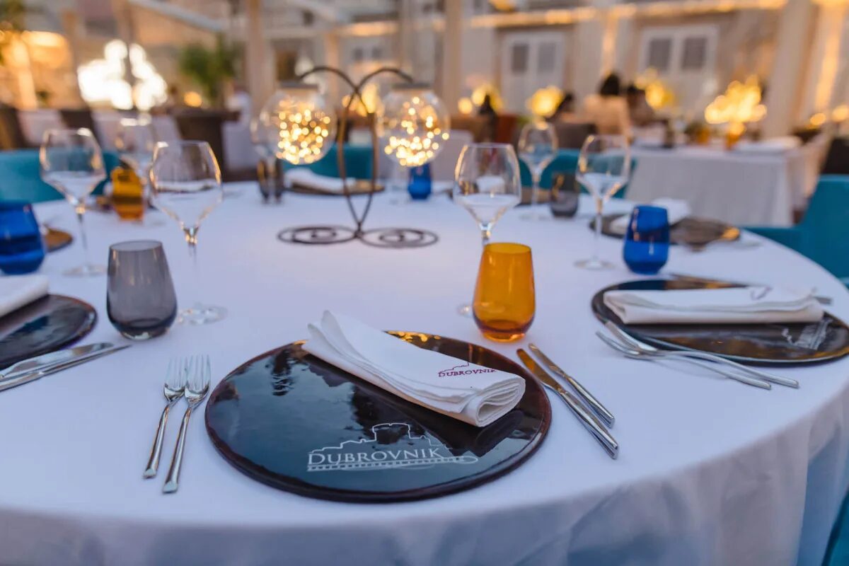 A dinner table set for guests on the terrace at Restaurant Dubrovnik